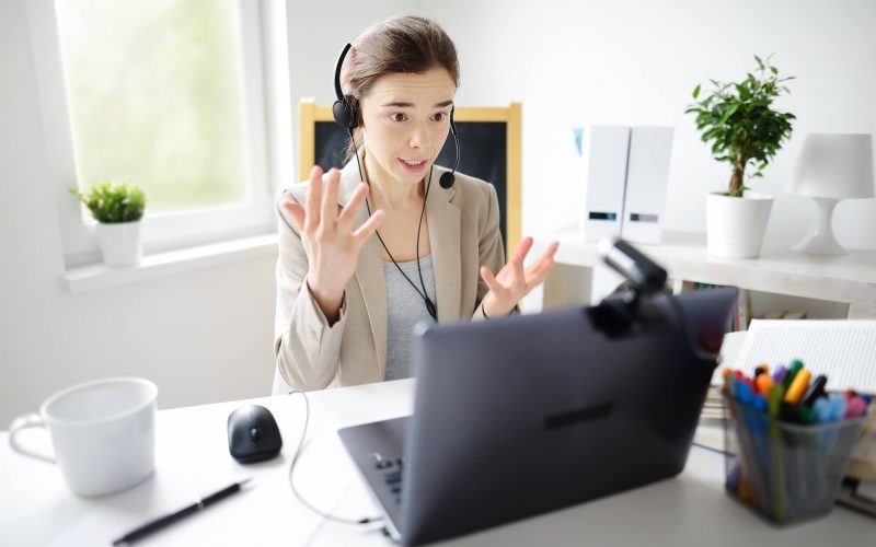 young-woman-is-learning-language-with-laptop-computer-camcorder-and-headphone-online-at-home-.jpg